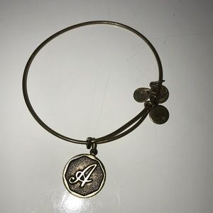 Gold Alex and ani bracelet with an A charm